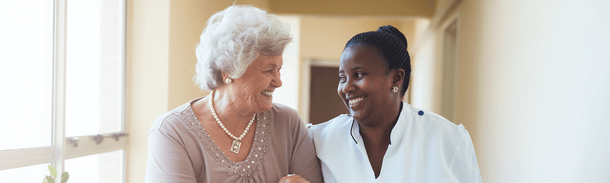 Patient and nurse smiling together