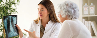 Patient and doctor reviewing an x-ray