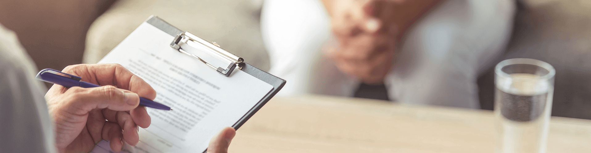 Doctor with paperwork on a clipboard