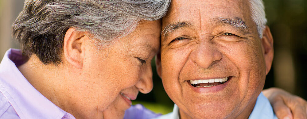 Couple smiling and embracing