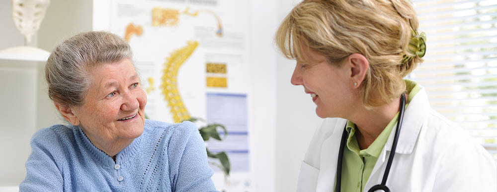 Patient and doctor smiling