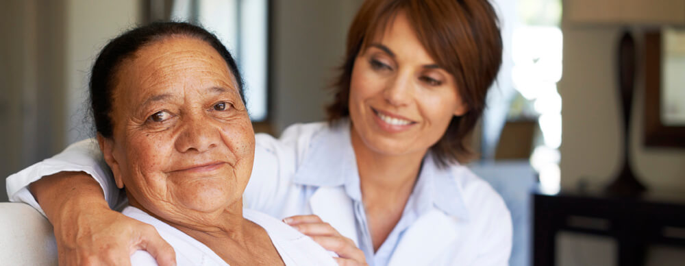 Doctor with arm around patient