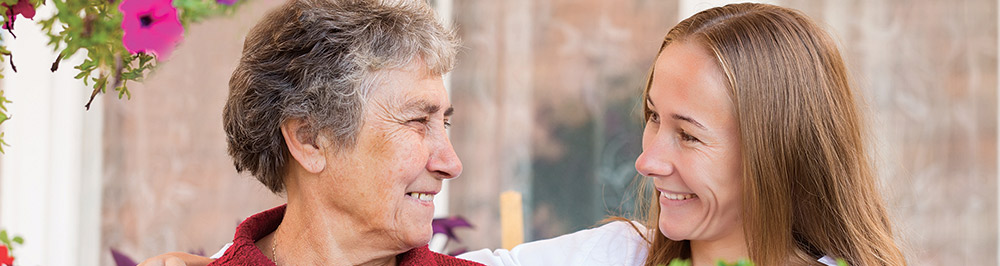 Patient and caregiver smiling